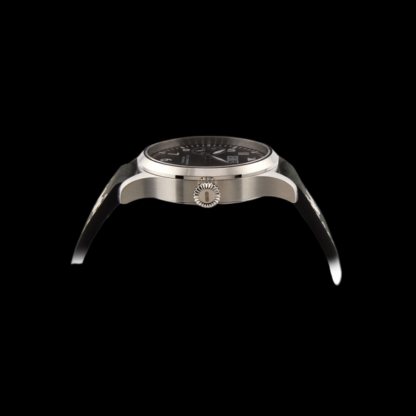 Watch with black face and silver case on a black background